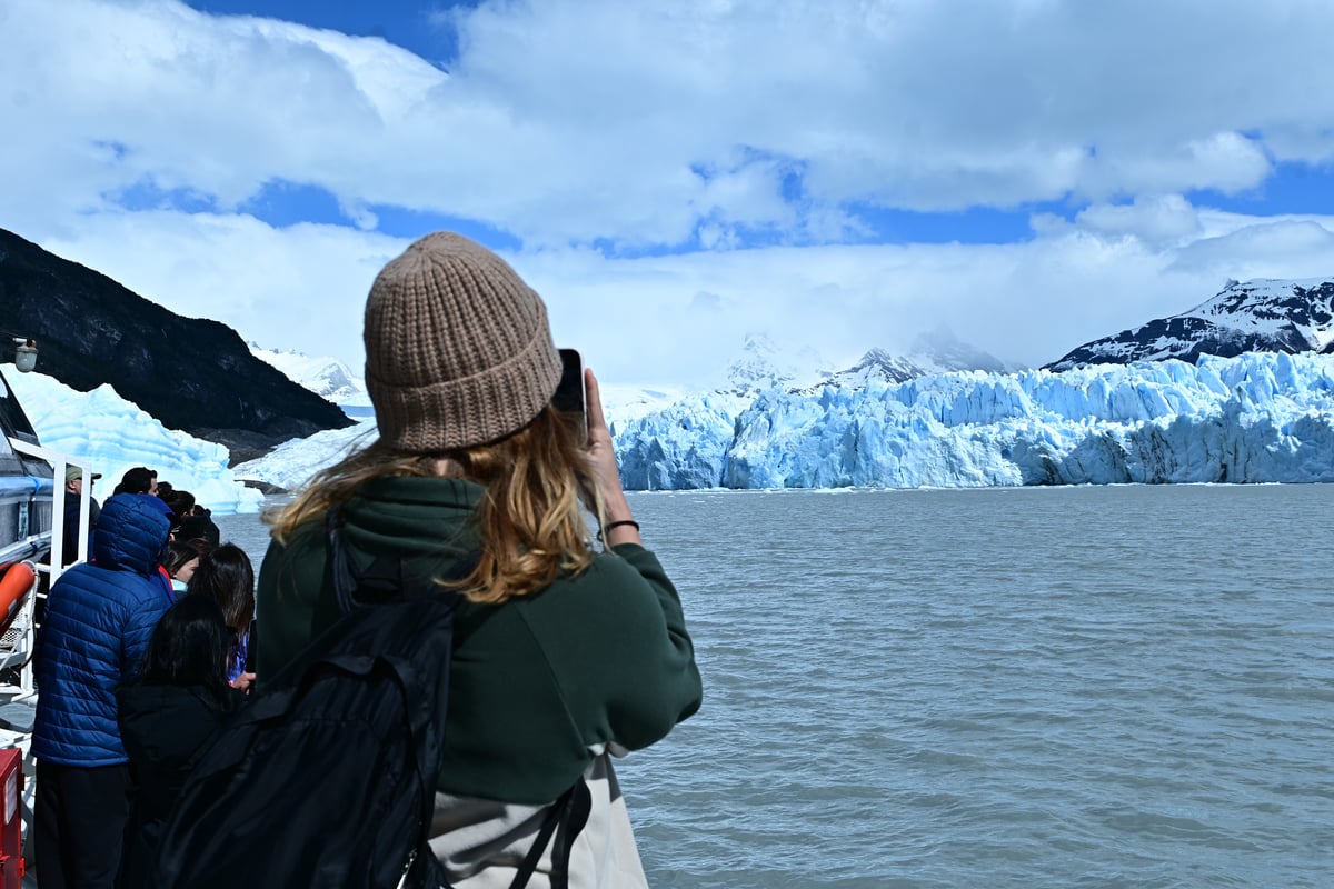Girl looking at Perito Moreno glacier in Patagonia