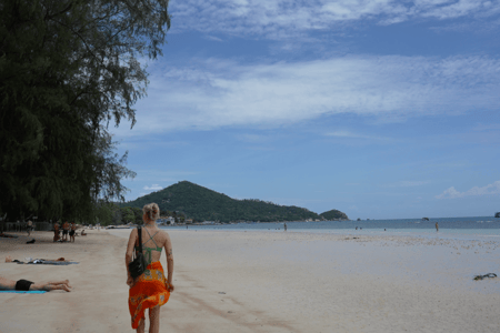 Someone walking along the beach in Thailand
