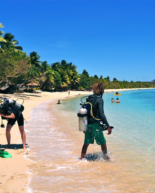 Divers on the beach in Fiji