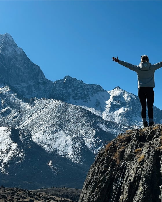Traveller standing on a mountaintop in Nepal