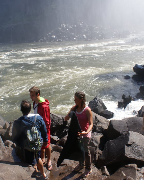 group of travellers by the zambezi river in zambia
