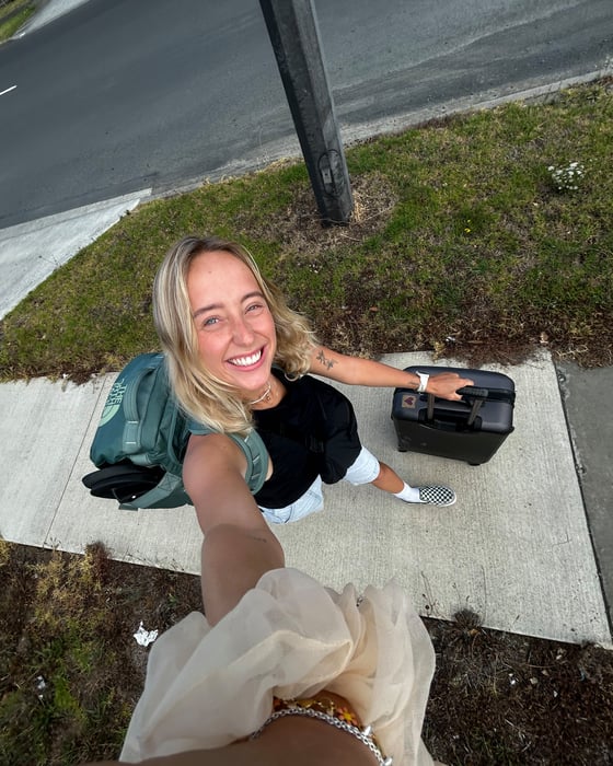 Girl with suitcases in New Zealand