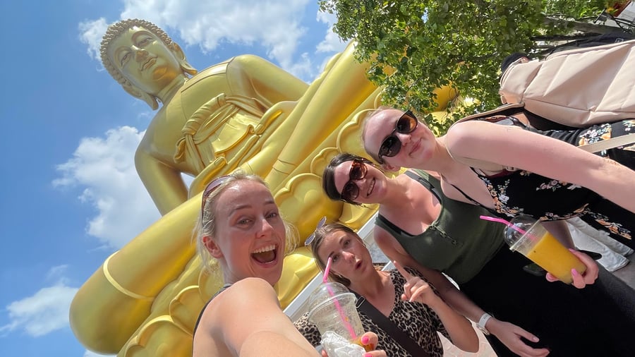 Travellers in front of Wat Paknam Phasi Charoen