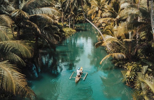 Drift along the emerald waters of Maasin River