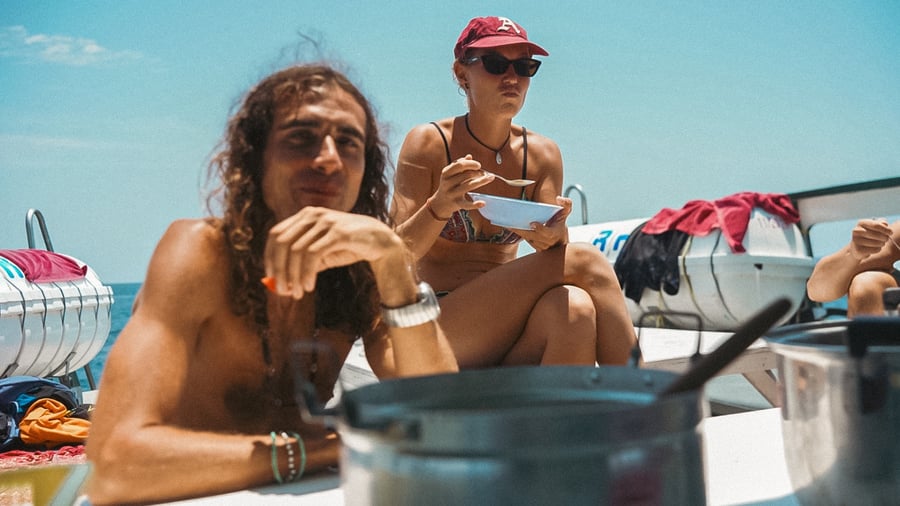 Two people relaxing on a boat in Koh Lipe