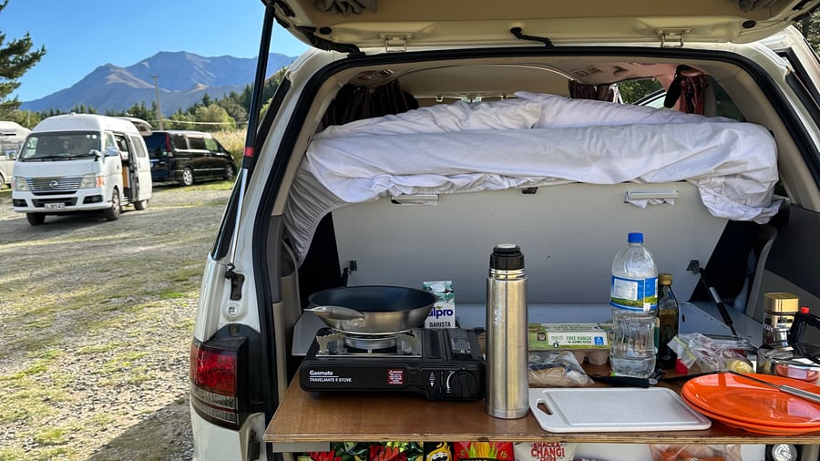 Campervan kitchen with a mountain view
