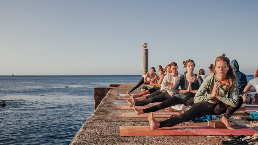 Sunrise yoga by the ocean