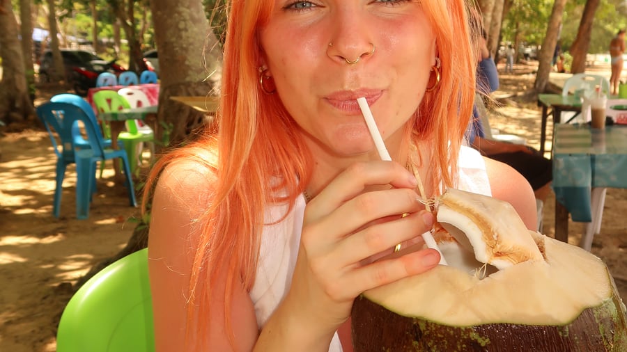 Enjoying a fresh coconut in Thailand 