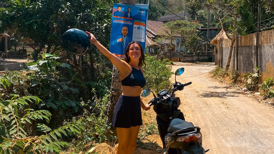 Girl by motorbike in Bali