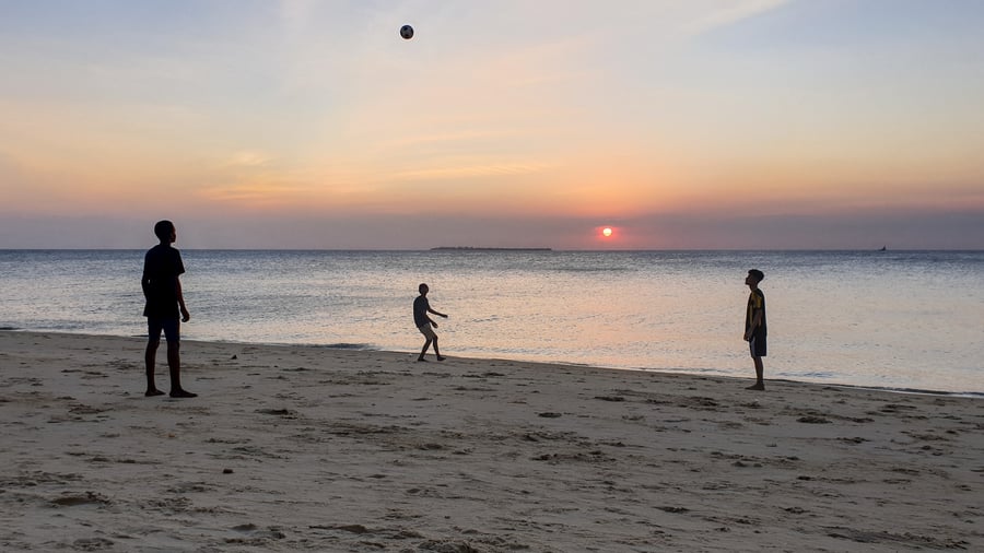 Playing football in the beach in Tanzania
