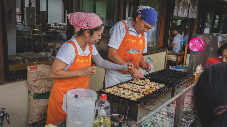 Takoyaki prepared at a street food stall