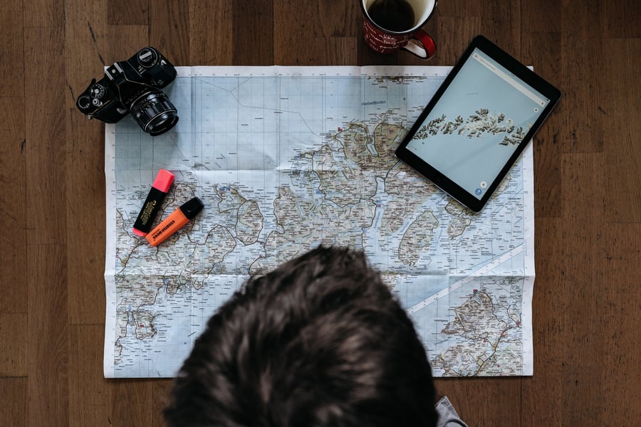 Person looking over a map